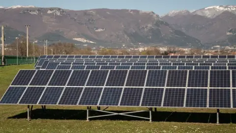 Getty Images solar panels in a field