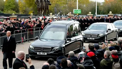 PA Media The funeral procession for Sir Bobby Charlton passes Old Trafford
