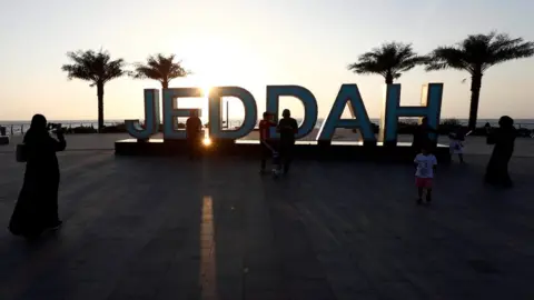 Reuters People stand on the corniche in Jeddah