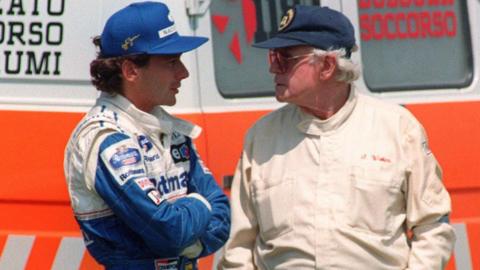 Ayrton Senna and Sid Watkins in conversation in the wake of Ronald Ratzenberger's crash