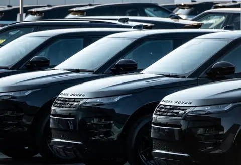 Getty Images A row of black Land Rover cars