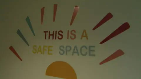 A sign saying this is a safe space in the children's homes