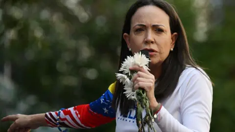 AFP via Getty Images  Venezuelan opposition leader Maria Corina Machado addresses supporters. 