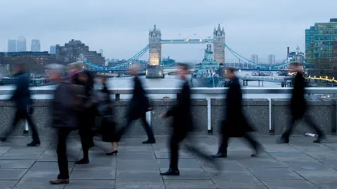 Getty Images Office workers walking implicit    London Bridge