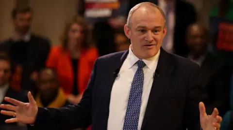 Sir Ed Davey delivers his speech on trade, relations with the EU and dealing with Donald Trump ahead of his return to the White House, to Liberal Democrat activists in central London