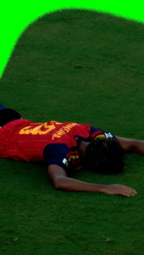 Lamine Yamal falls to the floor to reacts to Spain's winning goal in the World Cup final.