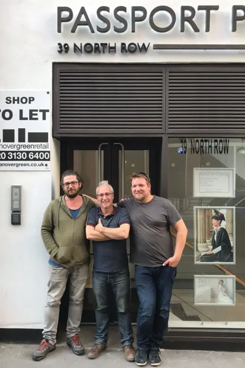 Philip Sharkey Philip Sharkey (centre) with photographers Ivo Carmo (left) and Piotr Gorka (right), outside 39 North Row.