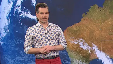 Nate Byne presenting the weather on ABC News Breakfast