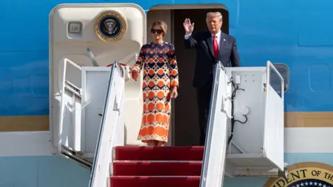 Getty Images Donald Trump and Melania Trump exit Air Force One at the Palm Beach International Airport