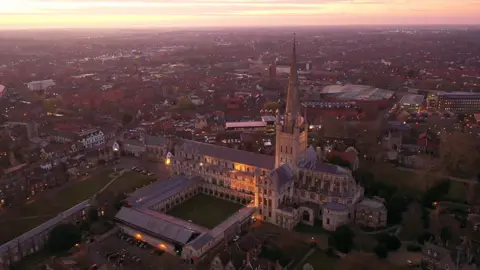 Chris Taylor Photo Aerial image of Norwich Cathedral at sunset