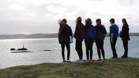 he Iolaire Memorial Project School pupils look out to the site of the Iolaire Disaster