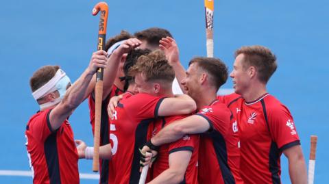 Gareth Furlong is congratulated after scoring Great Britain's fifth goal against Ireland
