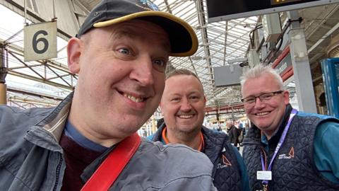 Tim Vine and two railway employees