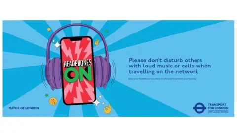 A blue, landscape shaped poster, with an image of a mobile phone wearing headphones, accompanied by some text asking people not to play loud music or make calls on loudspeakers.