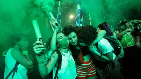 Reuters Demonstrators in favour of legalizing abortion react after the senate passed an abortion bill, in Buenos Aires, Argentina, December 30, 2020.