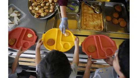 Reuters Children receiving school meals