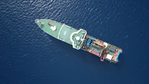 Aerial view of a scientific vessel at sea