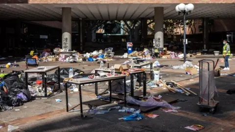 Getty Images Debris lay strewn on the ground at the Hong Kong Polytechnic University in the Hung Hom district of Hong Kong, China, on Friday, Nov. 29, 2019.