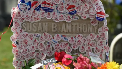 Reuters Susan B Anthony's grave is photographed littered with stickers