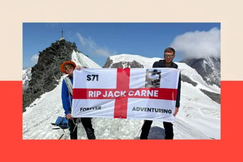 Brandan unfurls a flag to remember Jack at a summit