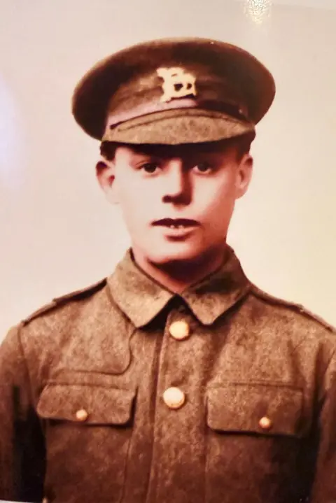 Whitaker family It is a very old sepia picture of a young solider in uniform