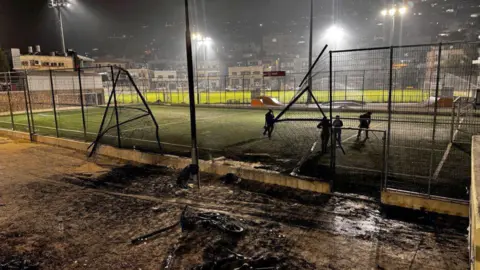 Getty Images Football pitch hit by rocket strike