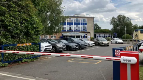 Lewis Adams/BBC The entrance to The Sandon School