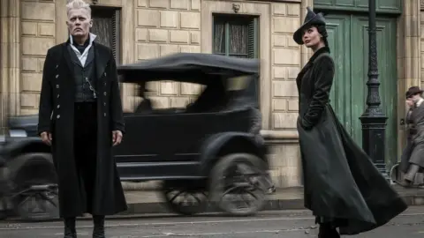 Warner Bros Johnny Depp and Poppy Corby-Tuech in Fantastic Beasts: The Crimes of Grindelwald