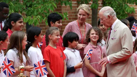 PA Media King Charles meets school children during a visit to the Oxford Centre for Islamic Studies in Oxford.