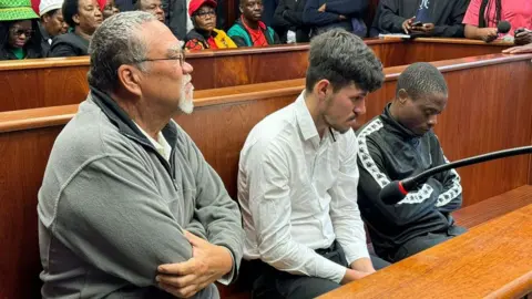 From left to right:  Farm owner Zachariah Johannes Olivier and his employees Adrian de Wet and William Musora in court in Polokwane, South Africa - Wednesday 2 October 2024