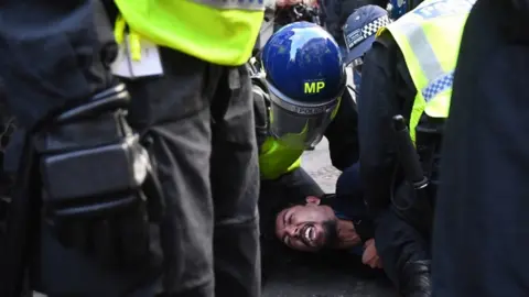 PA Media Protester being arrested