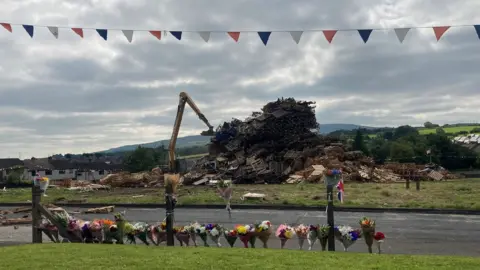 Antiville bonfire being dismantled
