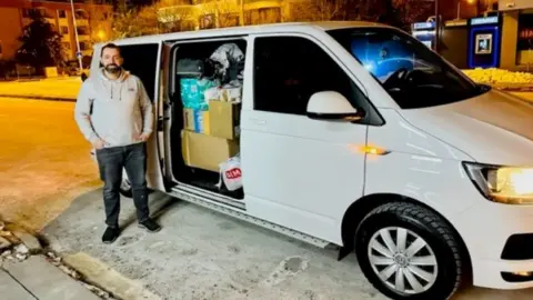 Brusk Korkmaz with the hired minibus in Turkey