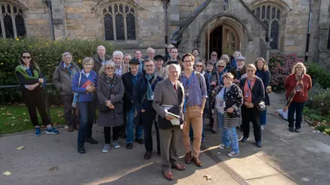 The Victorian Society About 25 people standing outside Bradford Cathedral