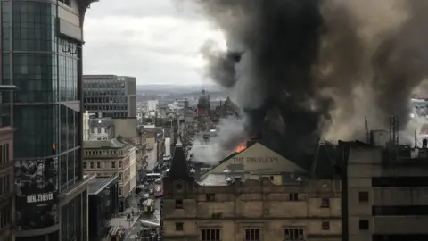 Jim Moore Flames visible from neighbouring streets