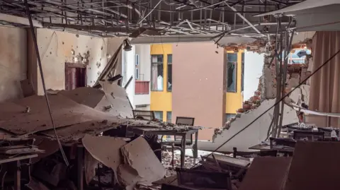 Jonathan Head/ BBC Royal Hill was badly bombed by the Thai army in December