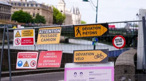 PA Signs along the river Seine during the Olympic Games