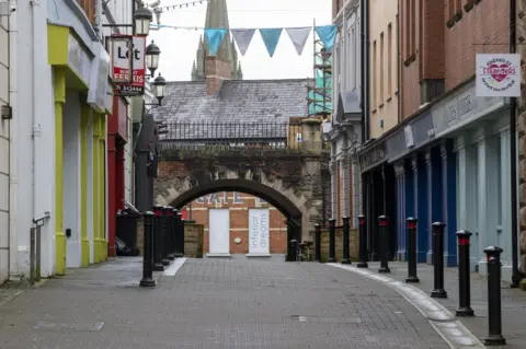 PA Media A deserted shopping street in Londonderry