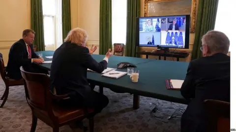 EPA Boris Johnson on a videoconference call with the leaders of the European Commission and European Council