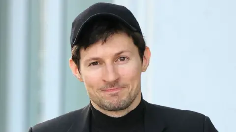 Getty Images Telegram founder Pavel Durov wearing a baseball cap