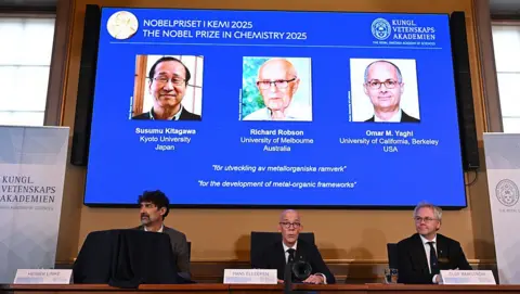 Getty Images Three members of the Nobel committee speak at a press conference in Stockholm