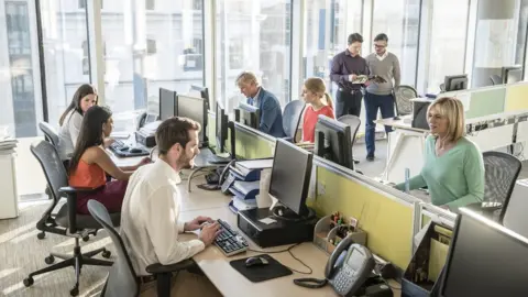 Getty Images Office workers