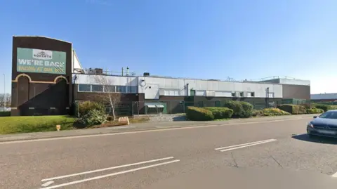 Google streetview of a large factory with Roberts branding on it saying "We're back baking at our best."