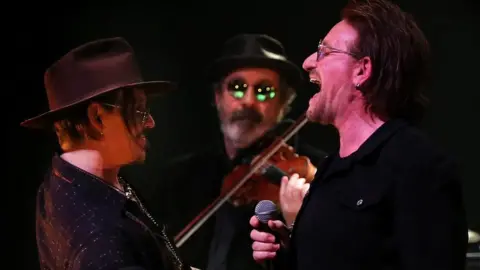 Steve Humphreys Bono and Jonny Depp perform