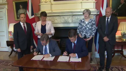 BBC The Conservatives and DUP sign deal in Downing Street