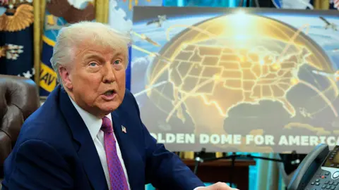 Donald Trump in front of a poster depicting the Iron Dome in the Oval Office of the White House. 