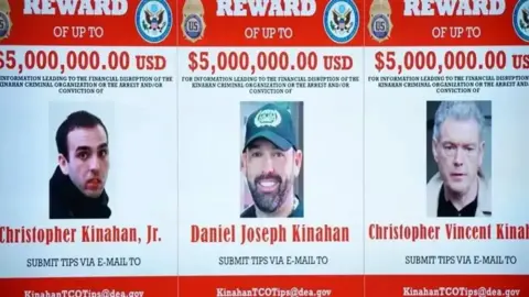 PA Media Three wanted posters of Christopher Kinahan Junior, Daniel Joseph Kinahan and Christopher Vincent Kinahan. Photos of the men are place in the middle of a 'Reward of up to five million USD' along with a tip off email address that reads KinahanTCOTips@dea.gov