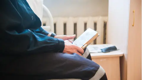 Getty Images Prisoner reading
