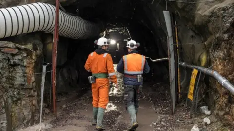 Scotgold Resources Workers at entrance to the mine at Cononish