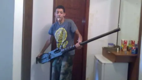 Manchester Arena Inquiry Salman Abedi holding a large gun